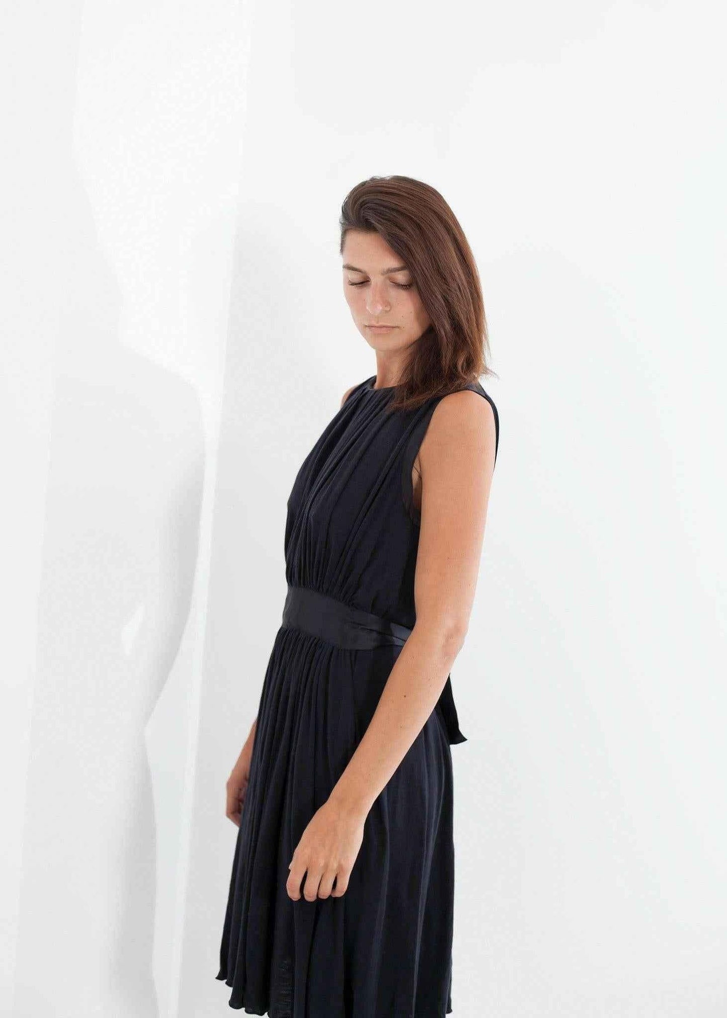 Sleeveless Pleated Dress in Navy.