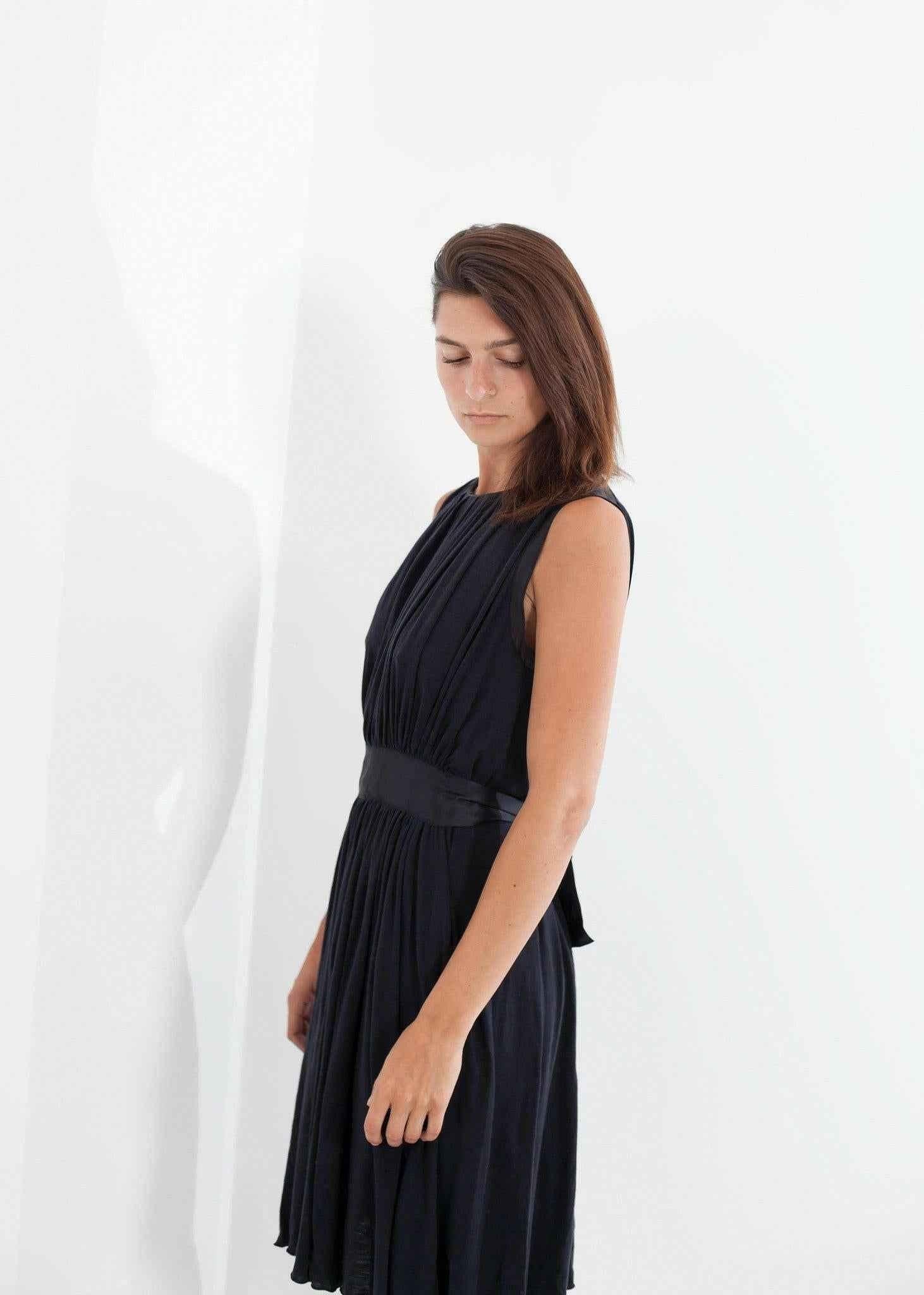 Sleeveless Pleated Dress in Navy.