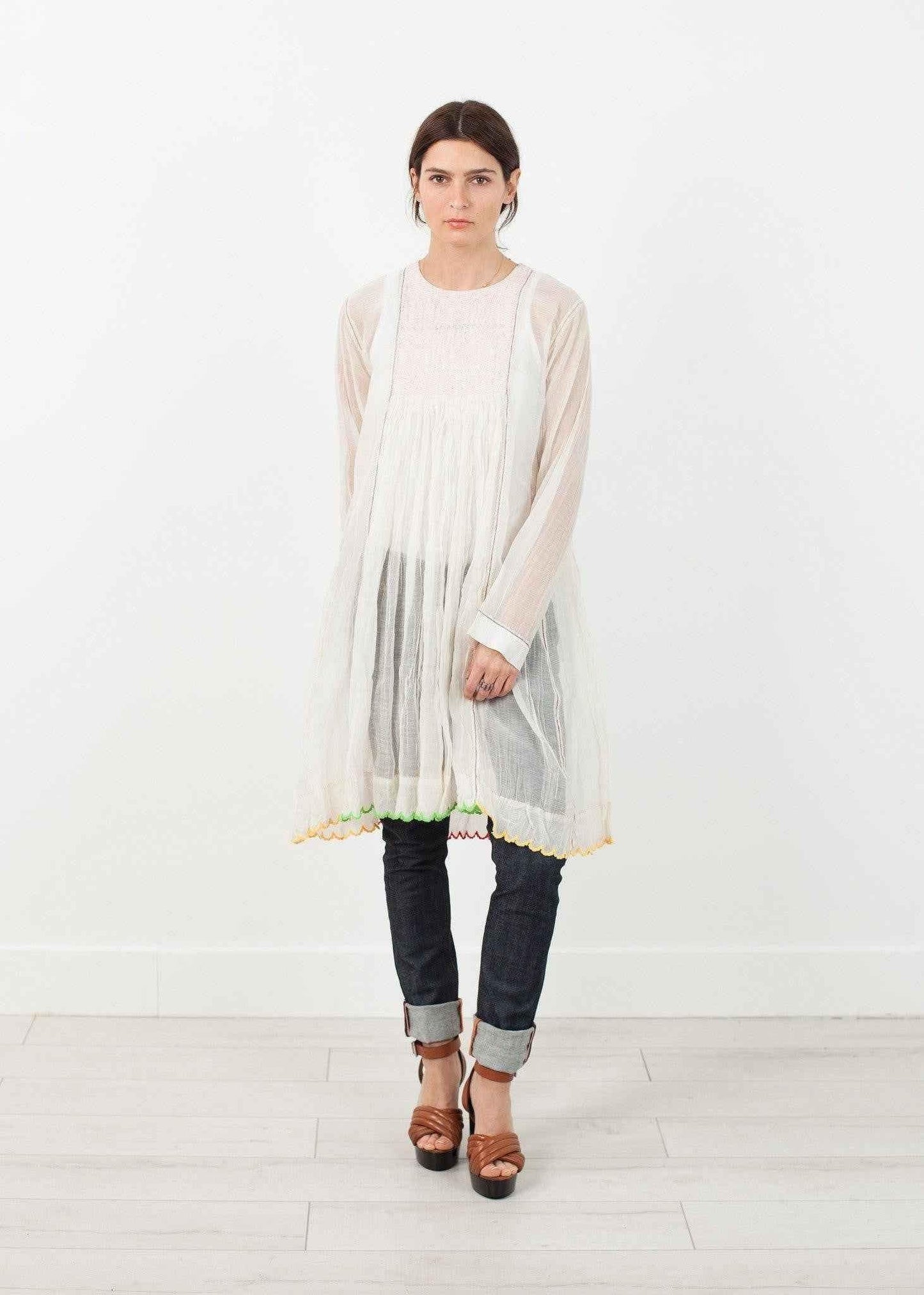 Pink Bib Dress in White.