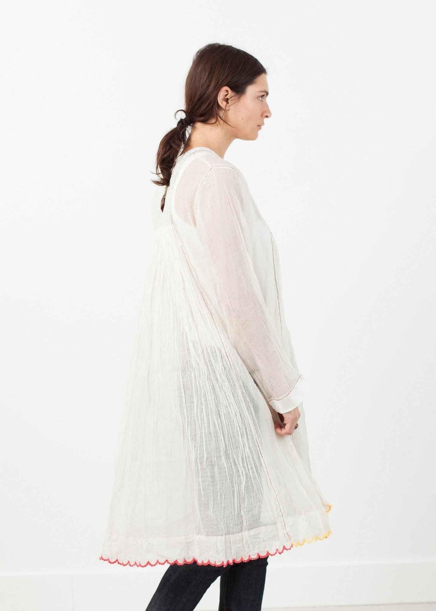 Pink Bib Dress in White.