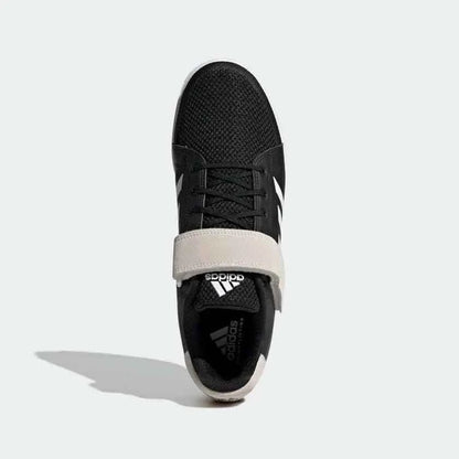 Black athletic shoe with white strap, mesh upper, and white accents, top view