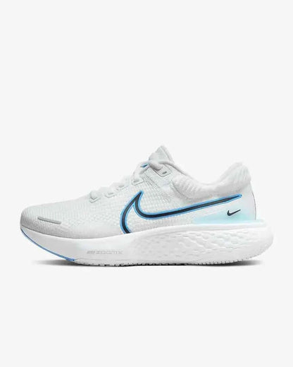 White running shoe with blue accent, textured sole, and knit upper on plain background