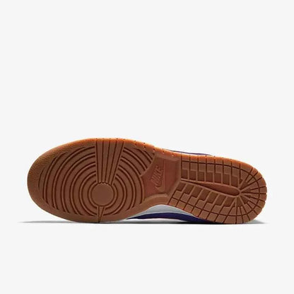 Brown rubber outsole of a sneaker with circular tread pattern on white background